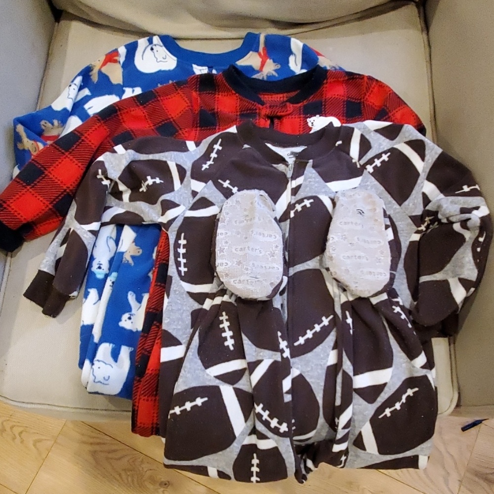 Three fleece Carter's footed pajamas